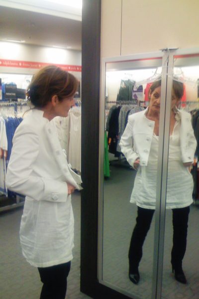 Lady Thérèse trying on a white jacket in Target.